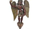 une image représentant une statue d'un ange tenant une balle