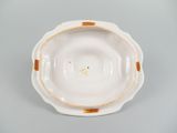an image of a white bowl with a gold rim on a gray surface
