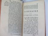 an open book with a picture of a man on it