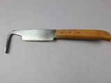 a knife with a wooden handle on a table