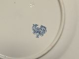 a white plate with a blue design on it