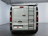 a white van with a ladder attached to the back of it