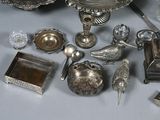 a lot of silver items that are on a table