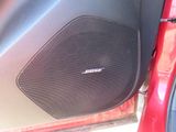 a speaker in the back of a car with the door open