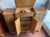 a wooden cabinet with a record player inside of it