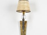 a lamp that is on the wall next to a lamp shade