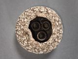 a close up view of a vase with a hole in it