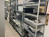 many shelves with dishes on them in the kitchen