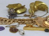 a lot of gold and silver jewelry on a table