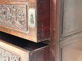 a wooden dresser with two drawers and a mirror on top