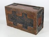 an old wooden box with a metal latch on it