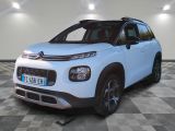 the white citrole is parked in a room with a checkered floor