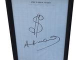 a black frame with a picture of a dollar sign on it