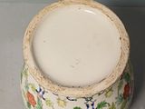 a white bowl with a floral design on it