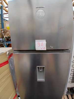 a large stainless steel refrigerator sitting in a warehouse