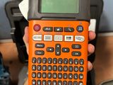 a person holding a calculator in their hand
