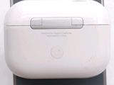 a white apple airpods sitting on top of an iphone