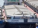 two boats that are docked in the water next to each other