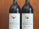 two bottles of wine that are sitting on a table