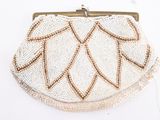 beige beaded purse with gold trimmings on a white background