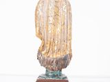 an image of a statue of a woman on a wooden base