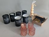 several glasses and a box of food on a table
