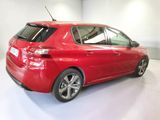 a picture of a red car parked in a garage