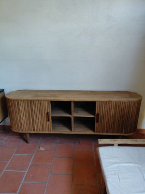 a wooden entertainment center in the corner of a living room