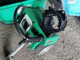 a green machine that is sitting on the ground