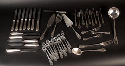 a lot of silver spoons and forks on the table