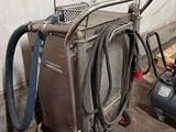 a machine that is sitting next to a air compressor