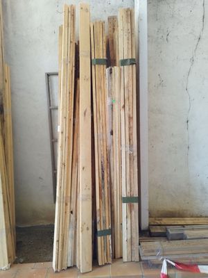 several pieces of wood are stacked on the floor in a room