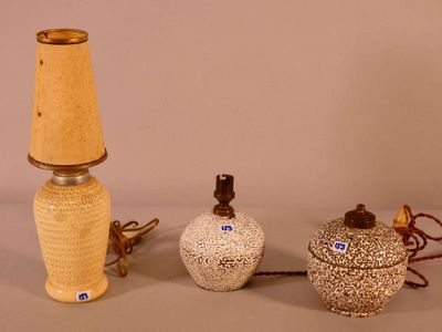 two lamps that are next to each other on a table