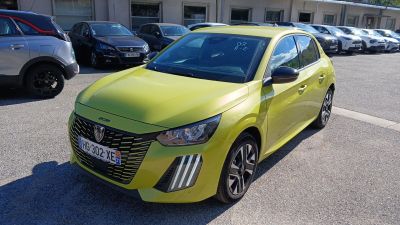 the bright yellow car is parked in a parking lot with other cars