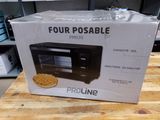 boxed picture of a microwave sitting on top of a wooden table