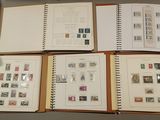 many different types of stamps on the pages of a book