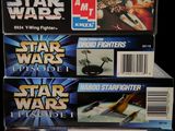 three boxes of star wars episode ii action figures sit on a table