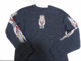 the back of a long sleeved shirt with flames on it