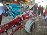 a tractor that is parked inside of a building