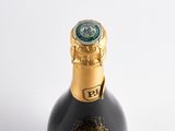a bottle of wine that is sitting on a table