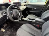 a picture of a car interior with a steering wheel and dashboard