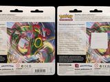 two packs of pokemon trading cards are shown on a black background