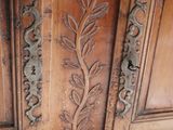 a large wooden cabinet with a decorative design on it
