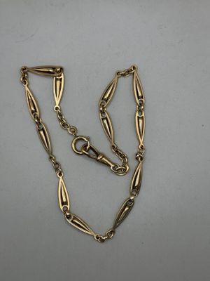 a gold plated necklace with a long chain and a clasp