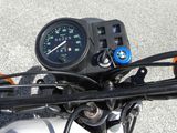 a close up of a motorcycle with a speedometer on it ' s handlebar