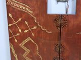 a wooden cabinet that has a clock on the side of it