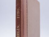 a brown book with writing on it sitting on a table