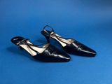 a pair of black shoes on a blue background