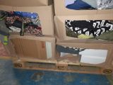 two boxes with clothes on top of them on a pallet