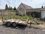 a trailer that is sitting in the dirt